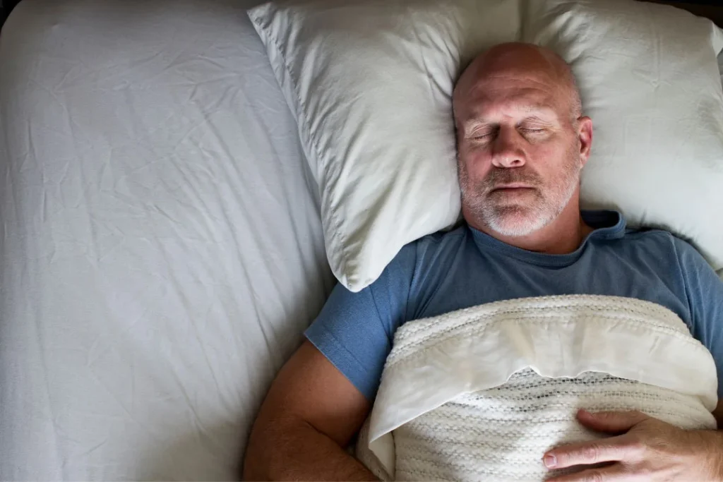 An old man enjoying a healthy sleep.