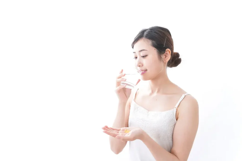 A girl taking supplement. 