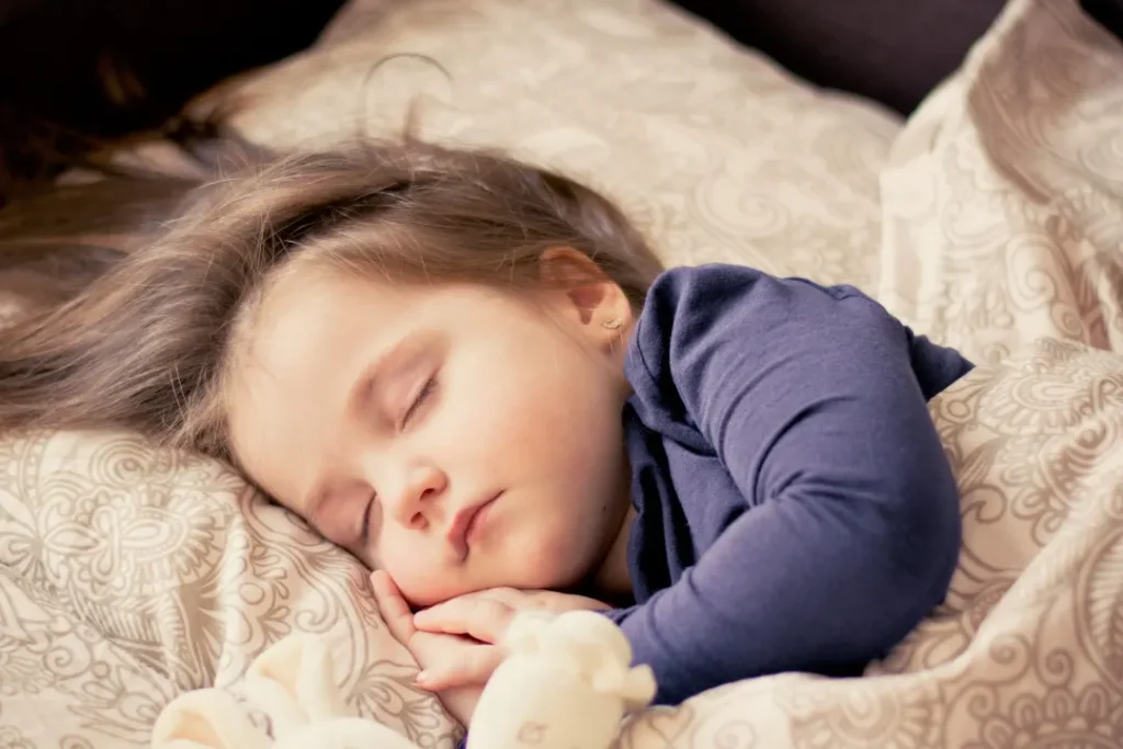 young little girl sleeping after intaking melatonin alternatives