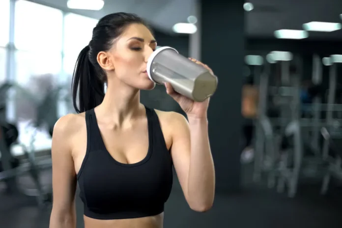 women drinking protein shake