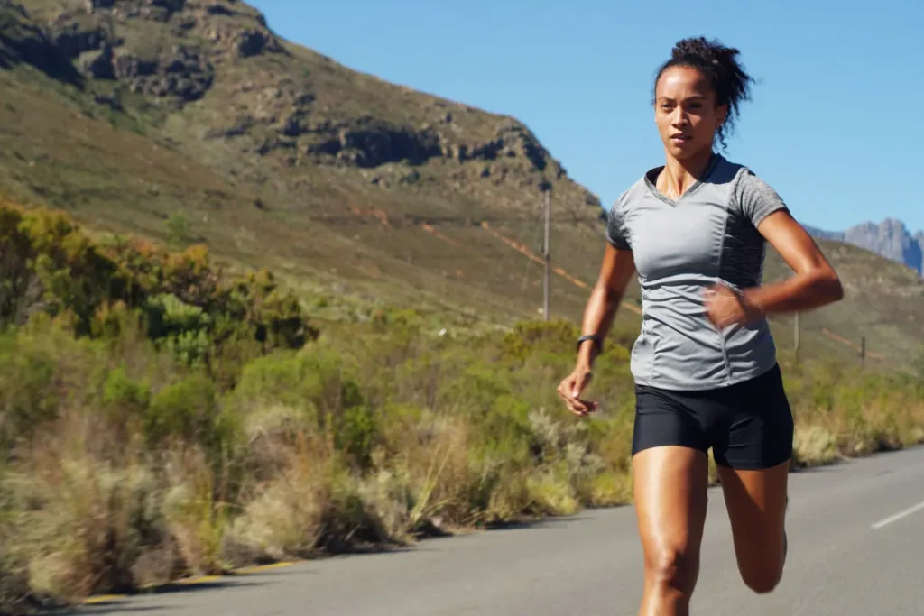 Lady running on the road. 